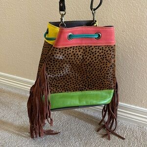 Upcycled leather bucket bag with fringe